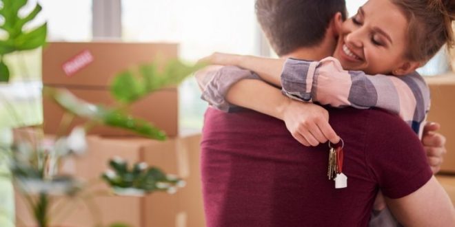 a girl hugs her friend in new home